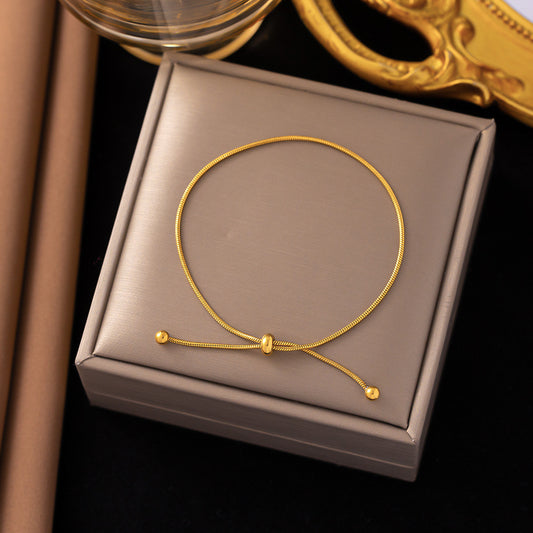 Flying Saucers tie bracelet gold