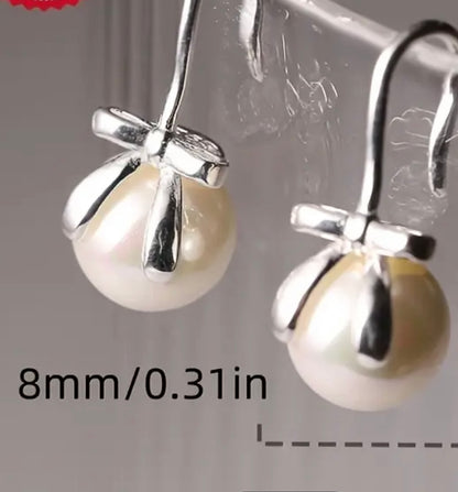 Flying Saucers s/silver bow and pearl  Earrings
